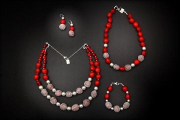 Red Huayruros and sterling silver pop against a black display!